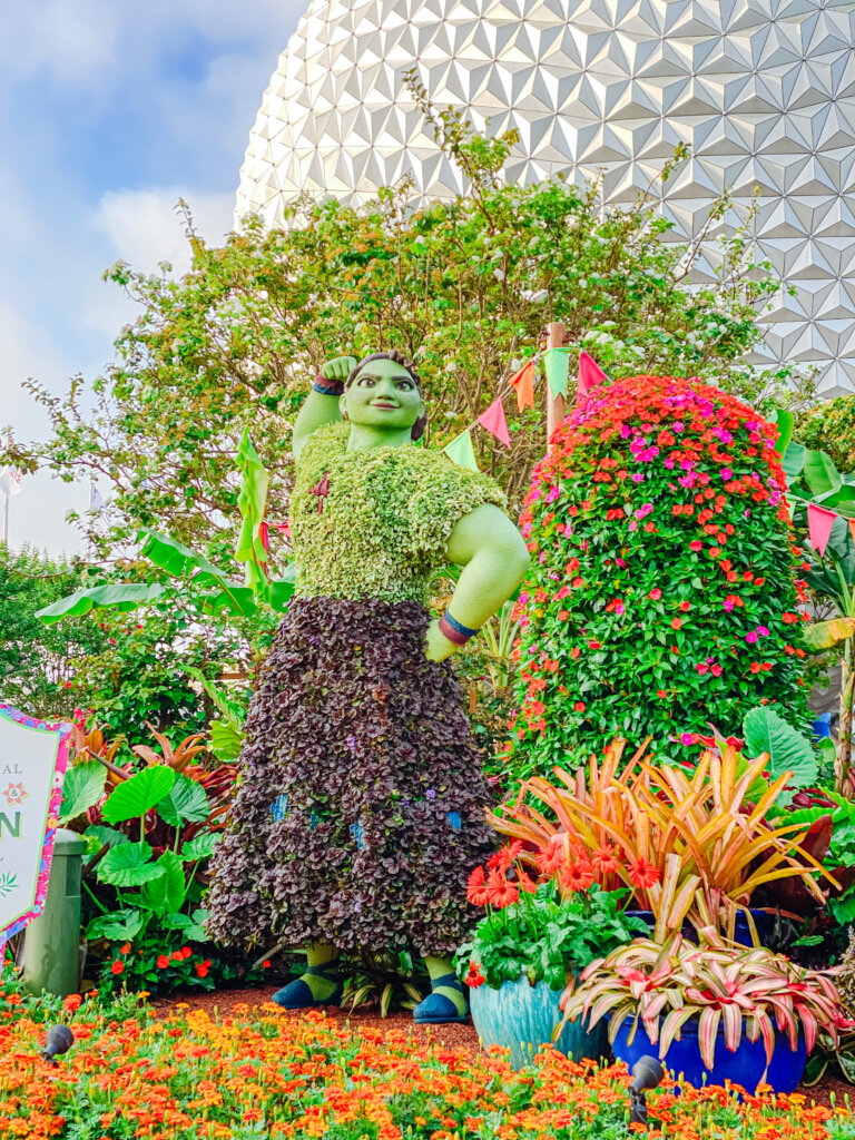 Luisa from Encanto made out of flowers and topiary for Epcot's Flower and Garden Festival