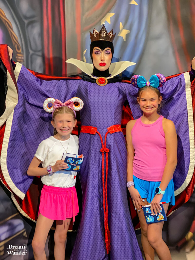 Storybook Dining at Artist Point image of 2 girls with Evil Queen from Snow White and the Seven Dwarfs